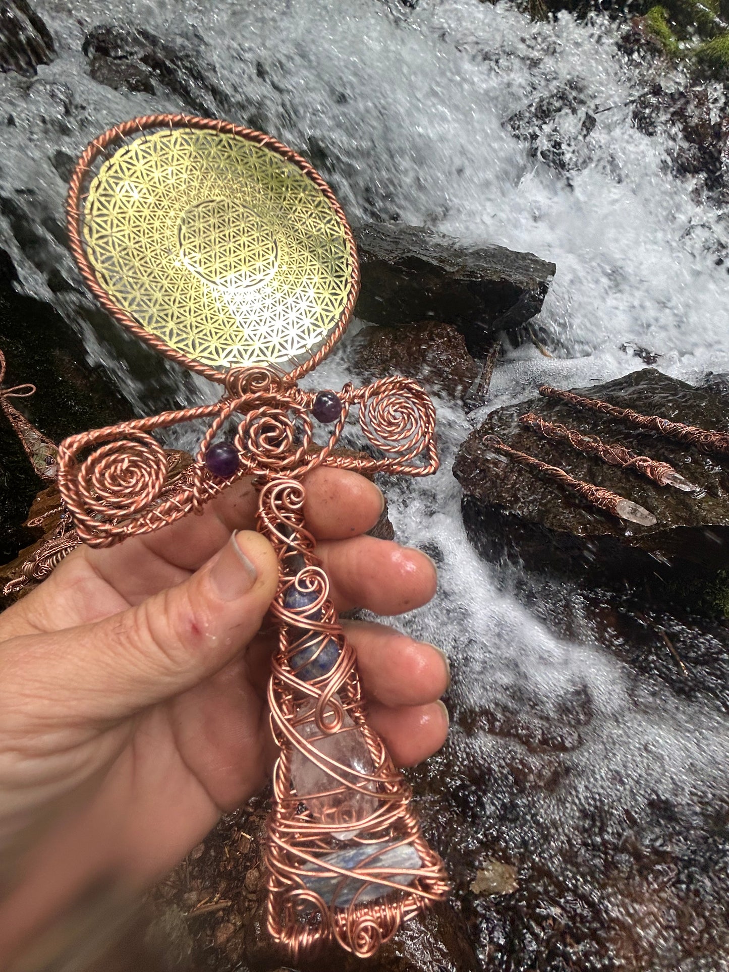 Handheld ankh with gold flower of life