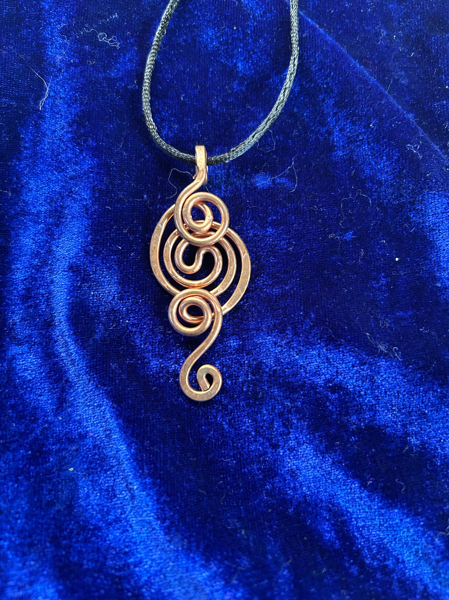 Whimsical hand woven copper pendant