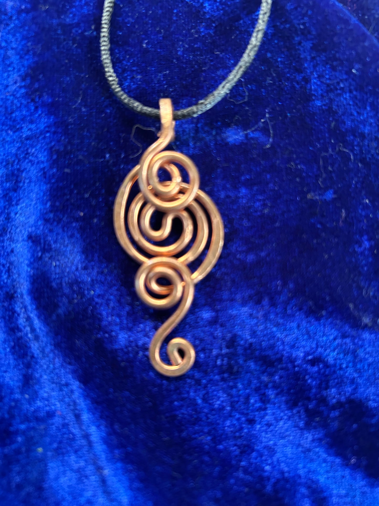 Whimsical hand woven copper pendant