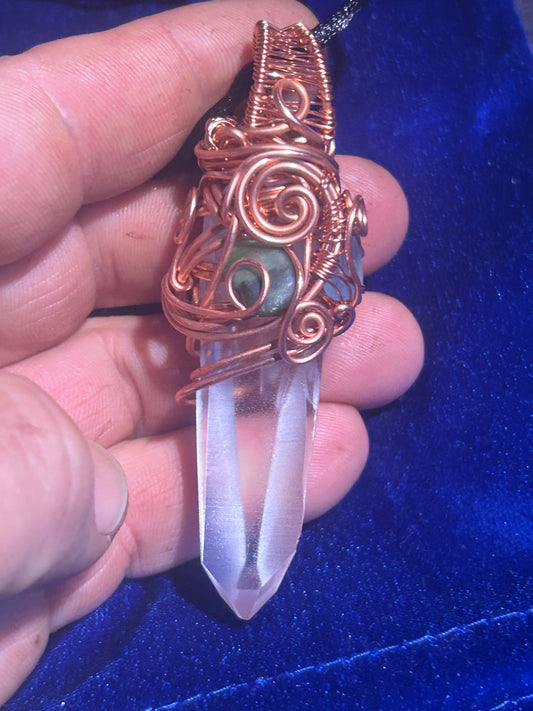 Lemurian quartz crystal with jade pendant