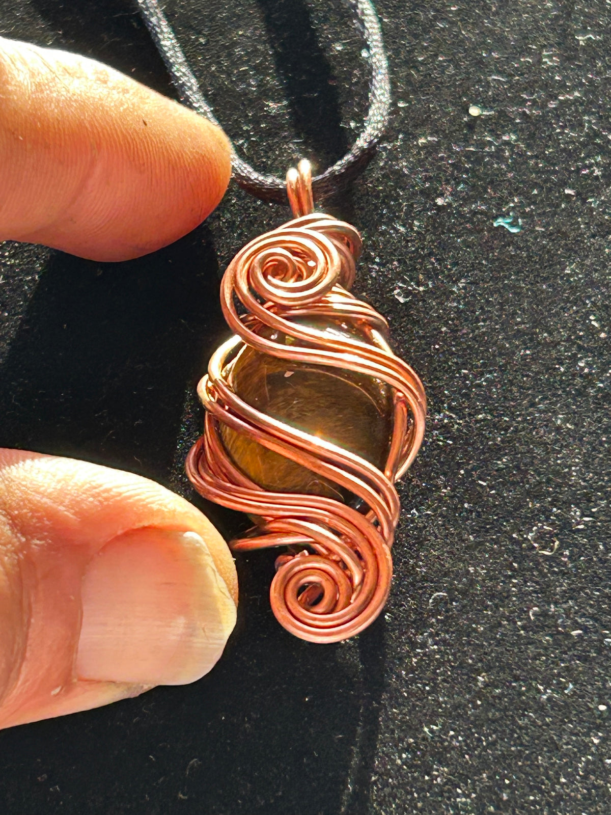 Tigers eye necklace pendant wrapped in copper