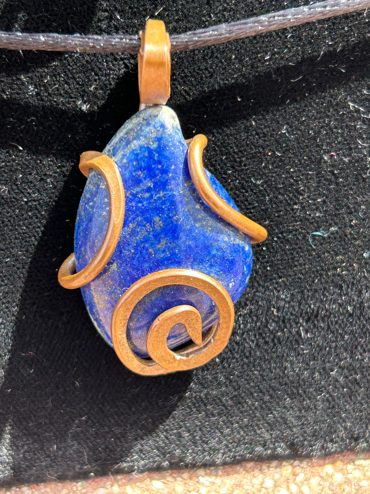 Lapis lazuli copper wrapped pendant stone of royalty and True communication
