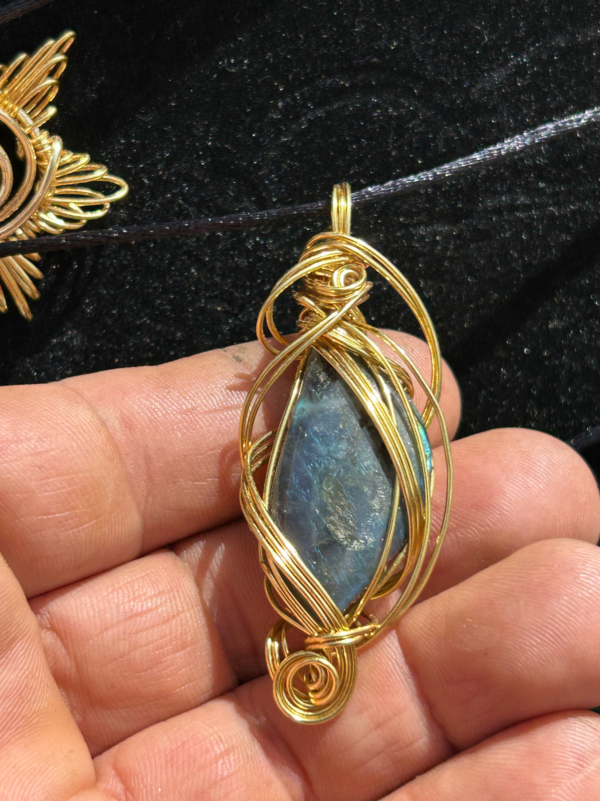 Labradorite pendant infused with aurora borealis