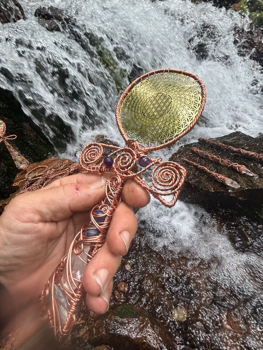 Handheld ankh with gold flower of life