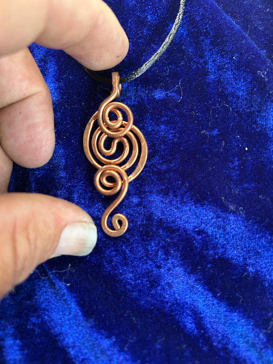 Whimsical hand woven copper pendant
