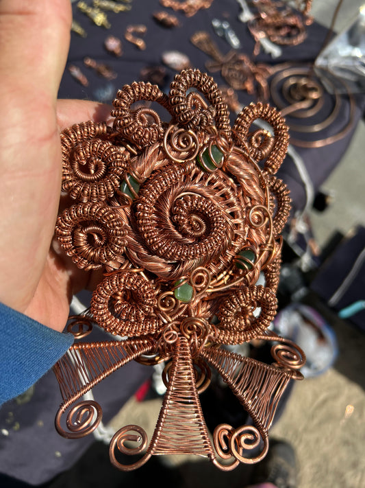 Copper and gems spiral together in a magical toroidal vortex flow to attract your wealth